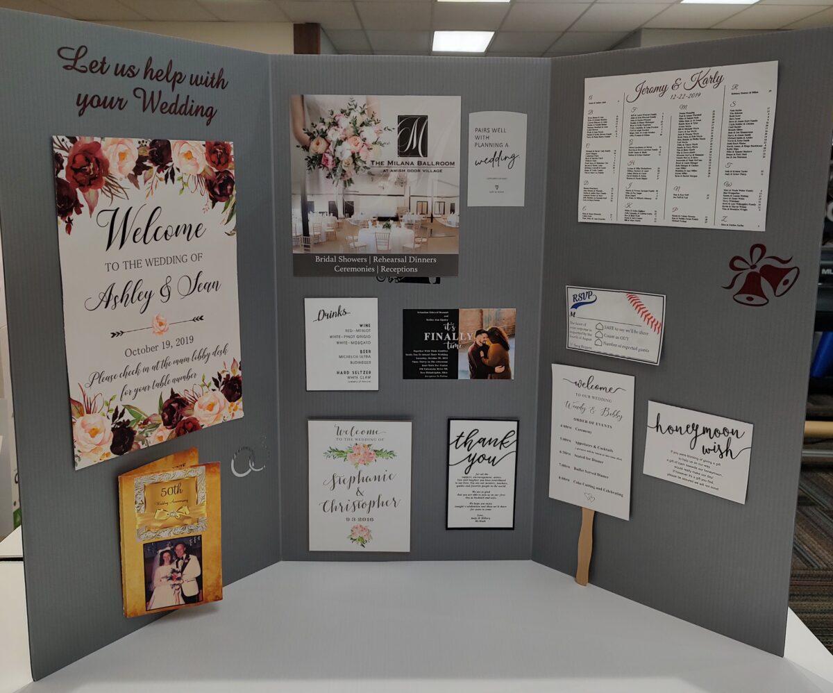 Display of a variety of invitations printed at Signs to Go